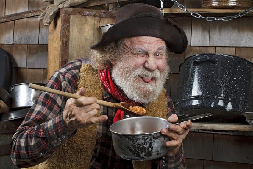 cowboy eating beans